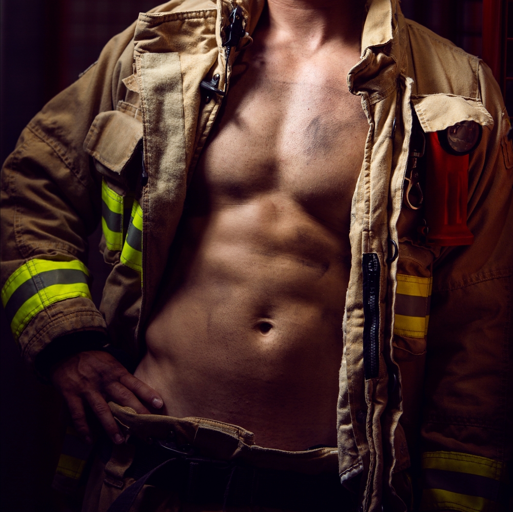 Firefighter,Wearing,Protection,Clothes,Showing,His,Muscular,Body